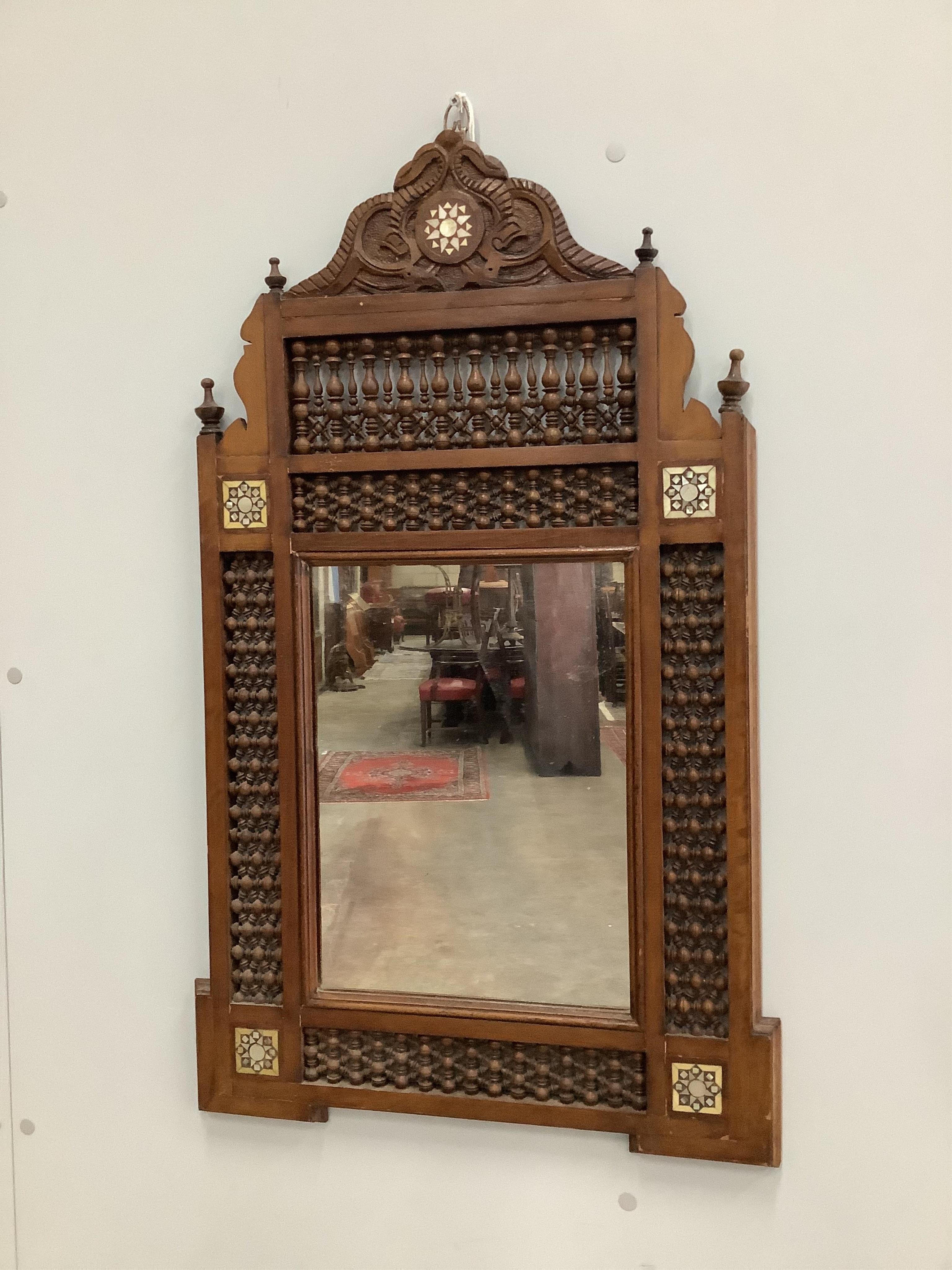 A Moorish mother of pearl inlaid wall mirror, width 52cm, height 87cm. Condition - fair